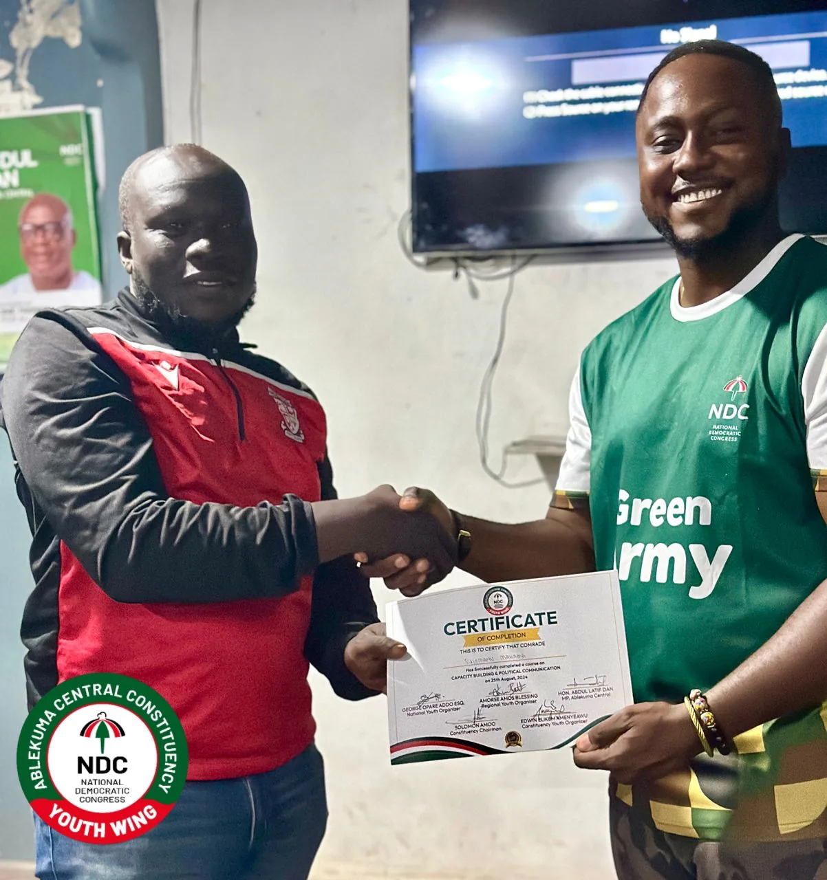 Edwin Elikem Amenyeawu presenting a certificate of completion in Capacity Building and Political Communication
